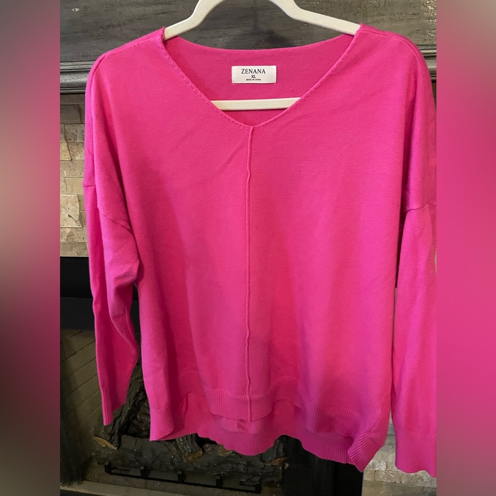 This pretty pink sweater is the perfect addition to your spring wardrobe.